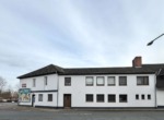 Gebäude Seitenansicht - Renditestarke Kapitalanlage: Gepflegtes Mehrfamilienhaus mit 5 Wohneinheiten & 3 Gewerbeeinheiten !
